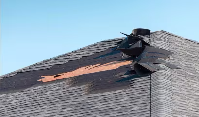Residential roof repair project in Denver following a severe storm
