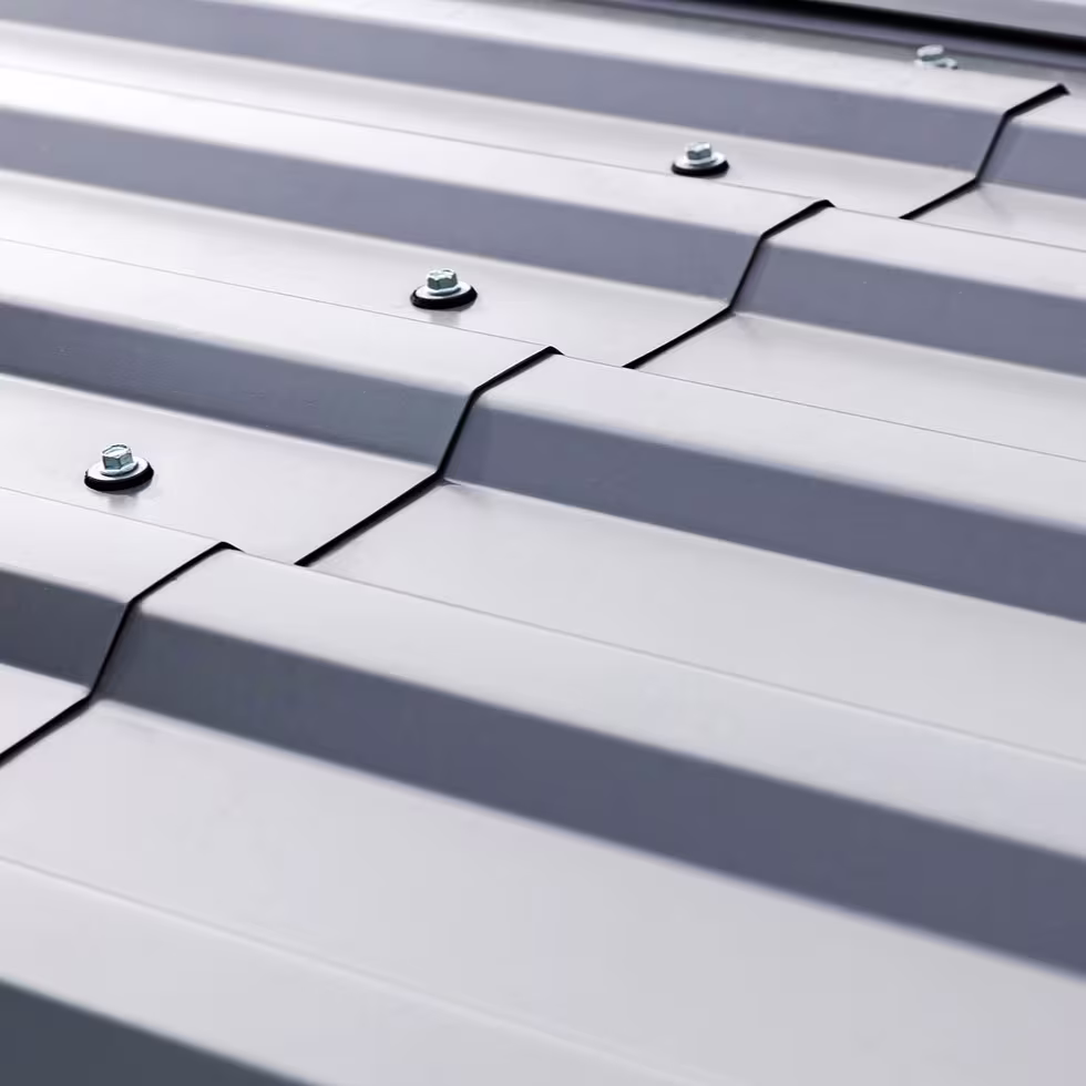 Standing seam and R-panel metal roof systems on Colorado commercial buildings