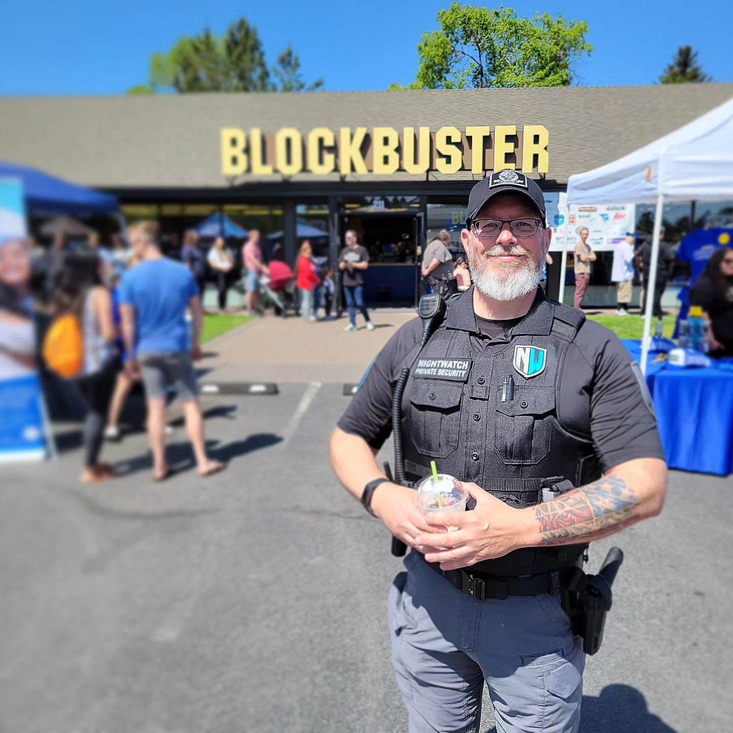 A security guard standing outside of the last Blockbuster on Earth.
