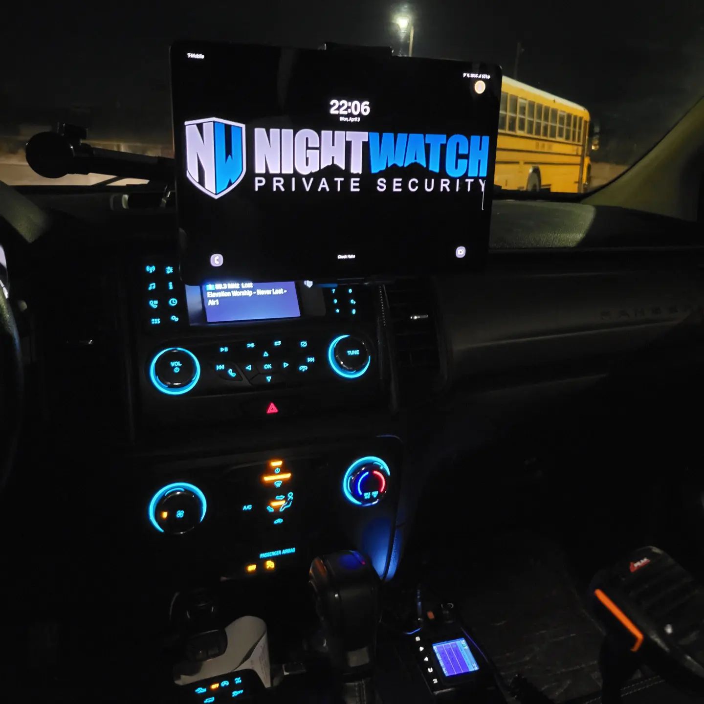A dashboard of a truck at night with a touch screen feautre.