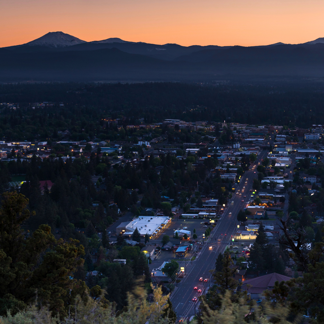 A photo of Bend, Oregon at sunset taken from Pilot Butte.