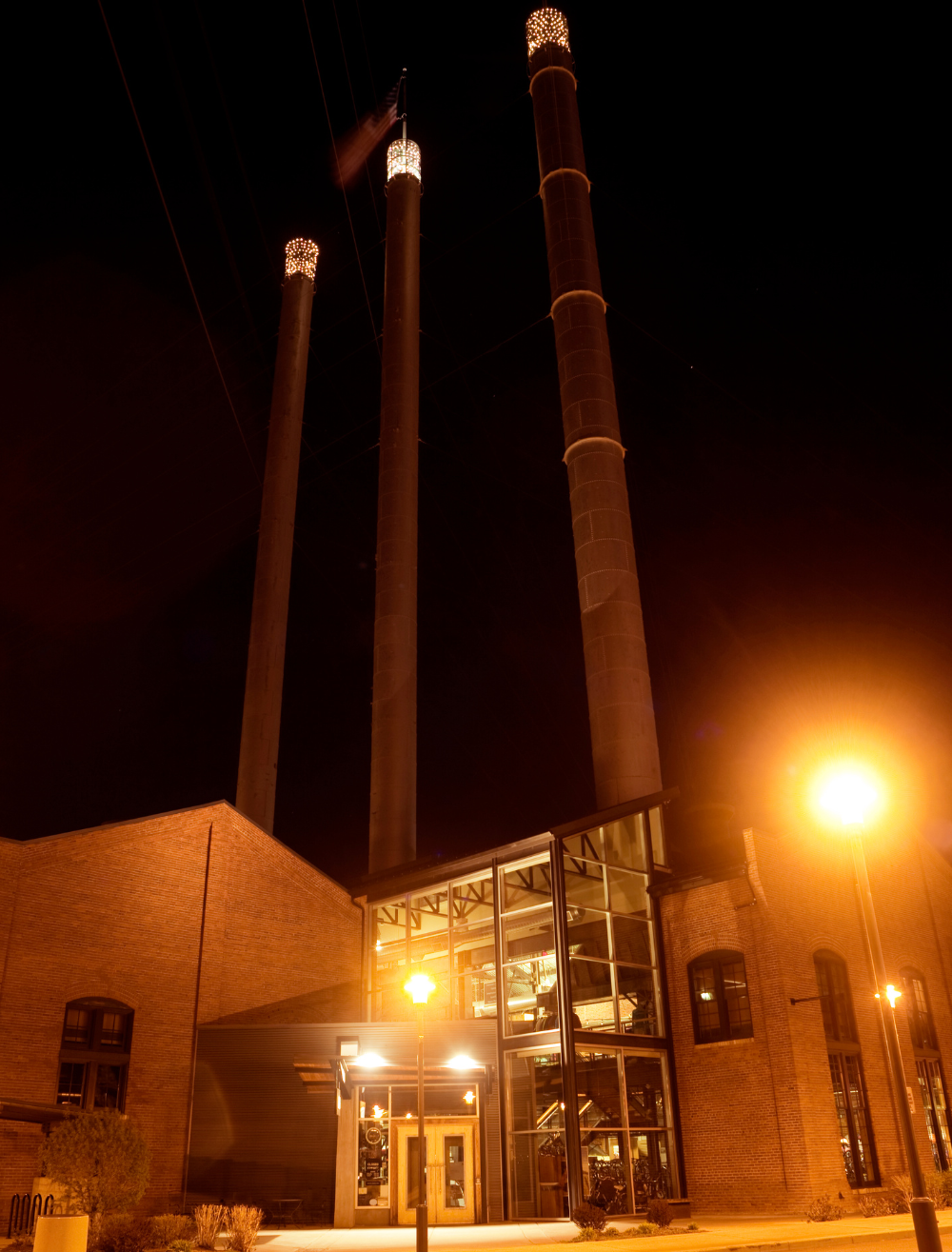 The smoke stacks at the Old Mill District in Bend, Oregon at night time.