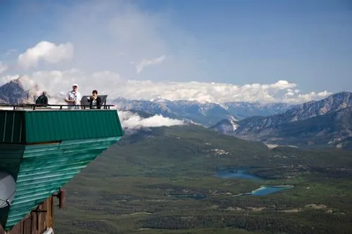Family at the Jasper Skytram looking over at the view of the Canadian Rockies, SunDog Tours Skytram & Shuttle