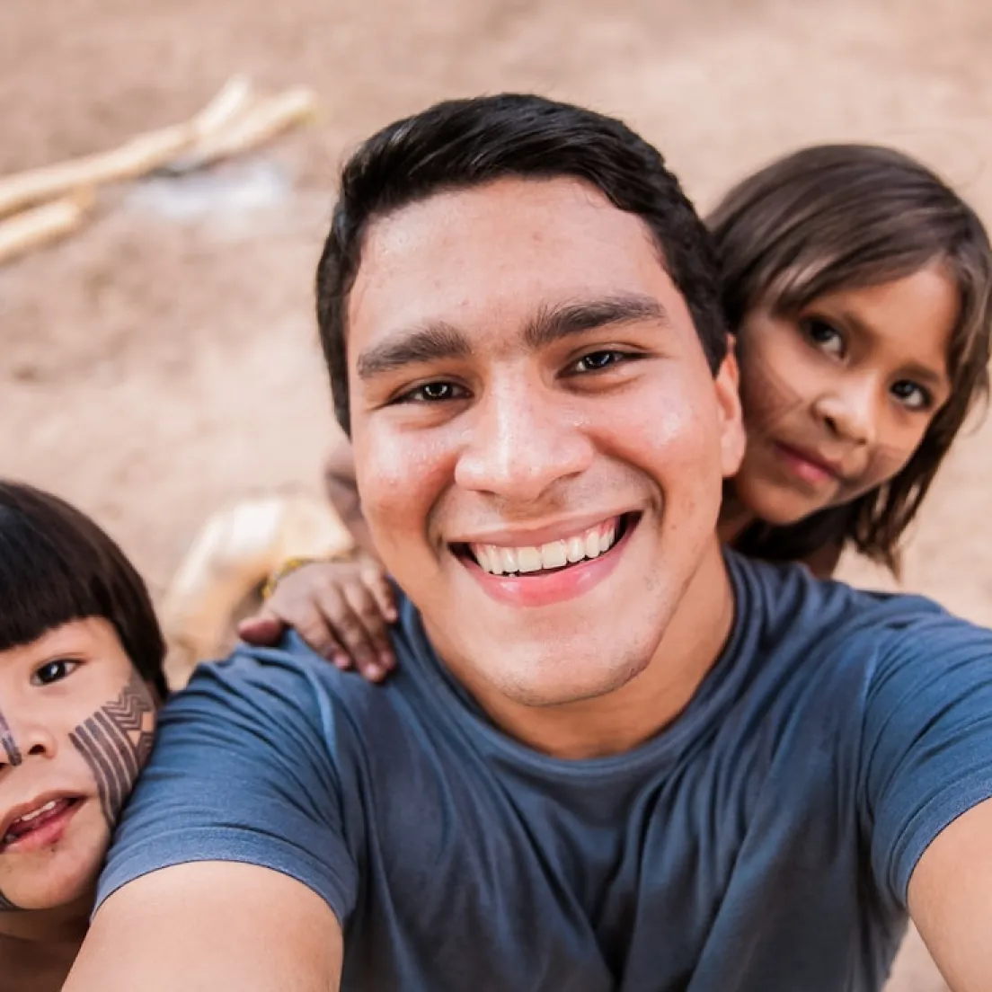 a man taking a selfie with two children - volunteer - best organization website webflow CMS template