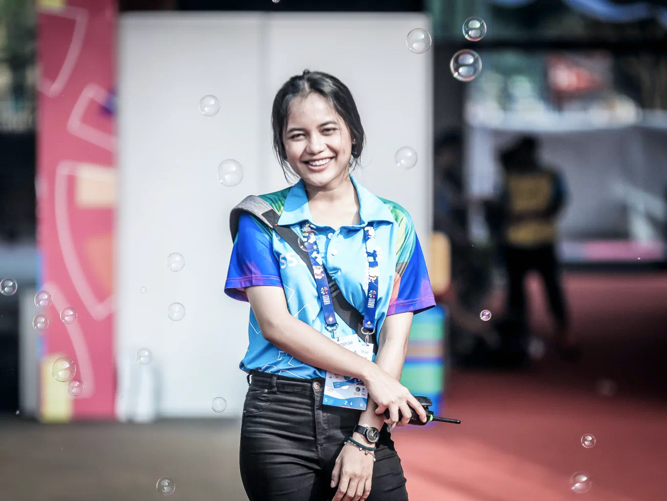 a woman standing in front of a building with bubbles in the air - volunteer - best organization website webflow CMS template