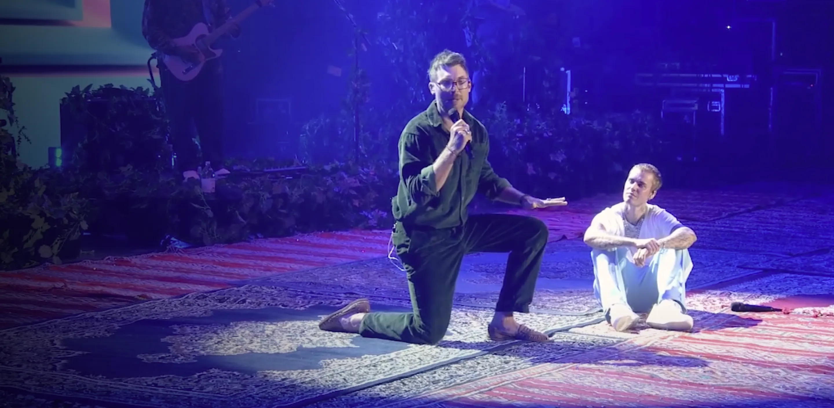 Justin Bieber and Judah Smith on stage talking about a special moment in their lives.