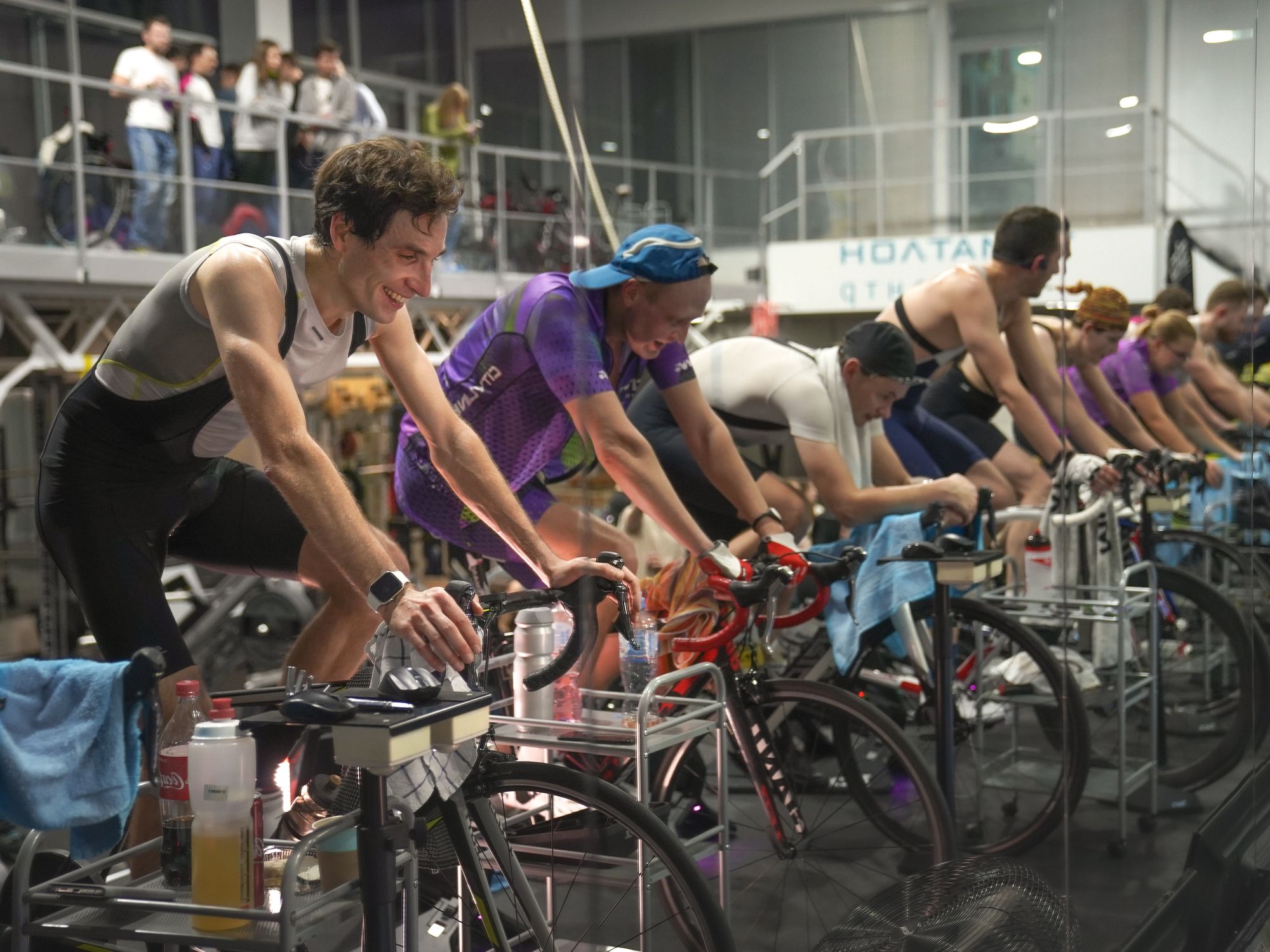 Cyclist training indoors on a smart trainer using an indoor cycling app