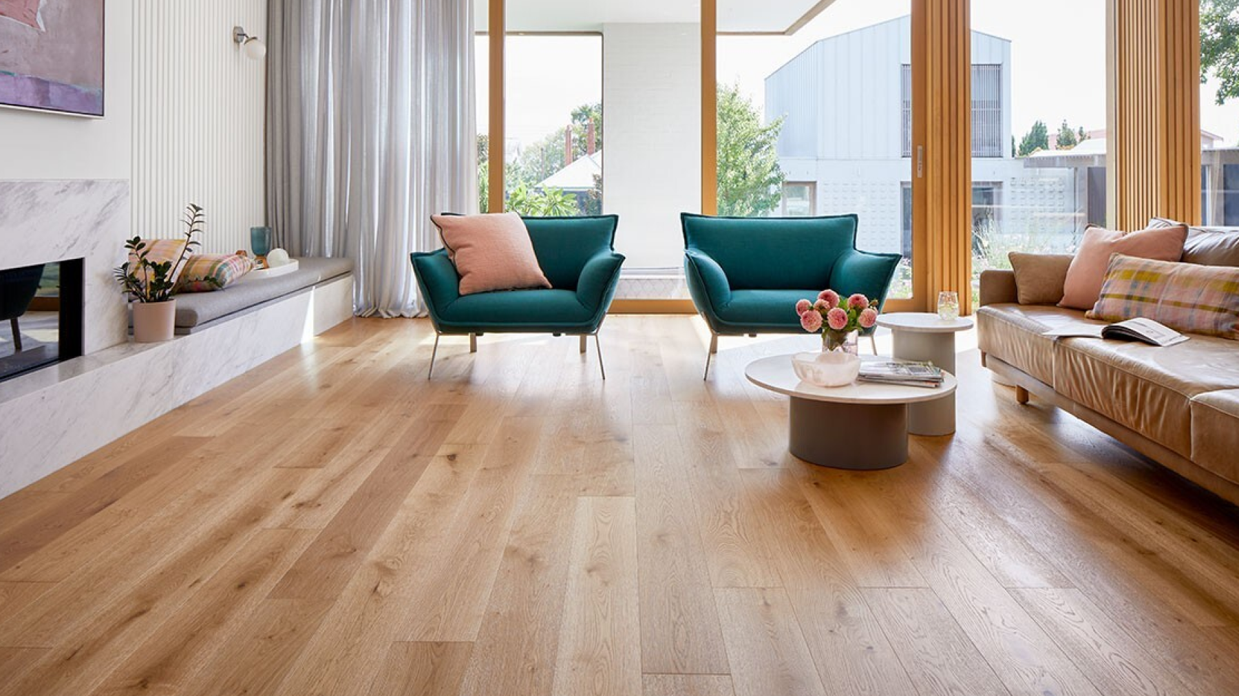 Contemporary living room featuring light-toned carpet flooring