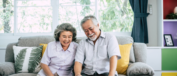 A man and a woman sitting on a couch