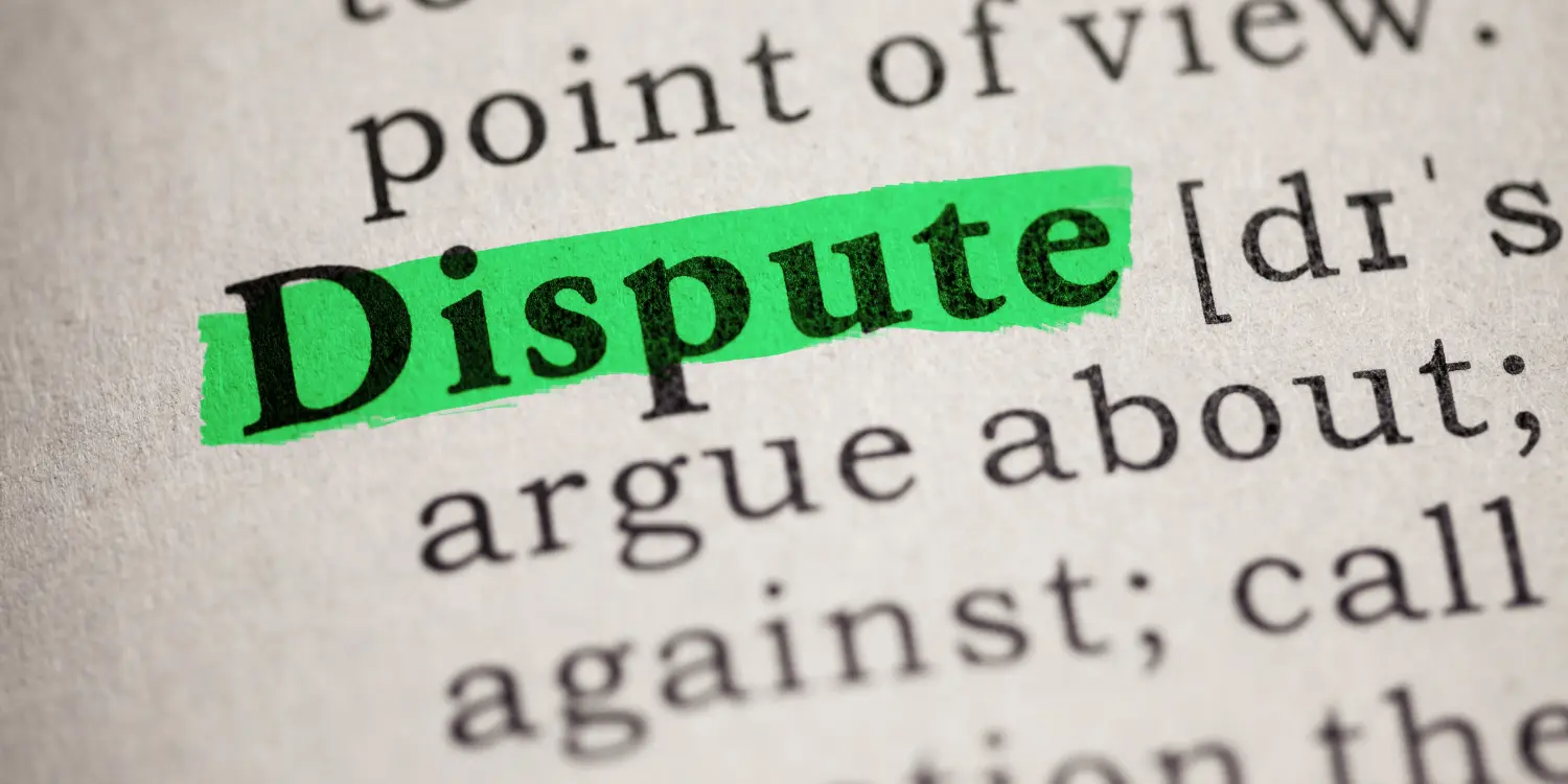 A page with the definintion of the word dispute illustrating that credit reports can be challenged for errors on them.