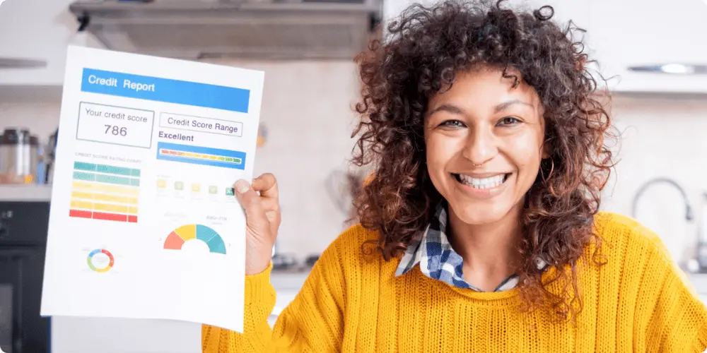 A person holding up a their credit report with a big smile upon discovering a higher credit score has been obtained with Credit.org's consumer credit counseling session.