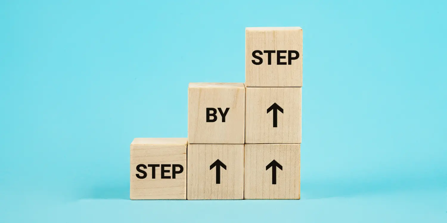 Blocks stacked to illustrate 'Step by Step' progress with upward arrows on blue background demonstrating the steps to achieve financial goals.