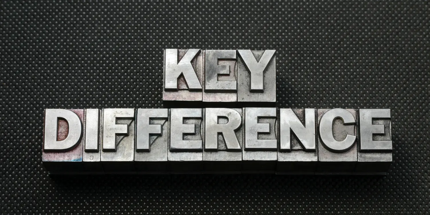 The  key differences between debt and credit spelled out in metal type on a black background.
