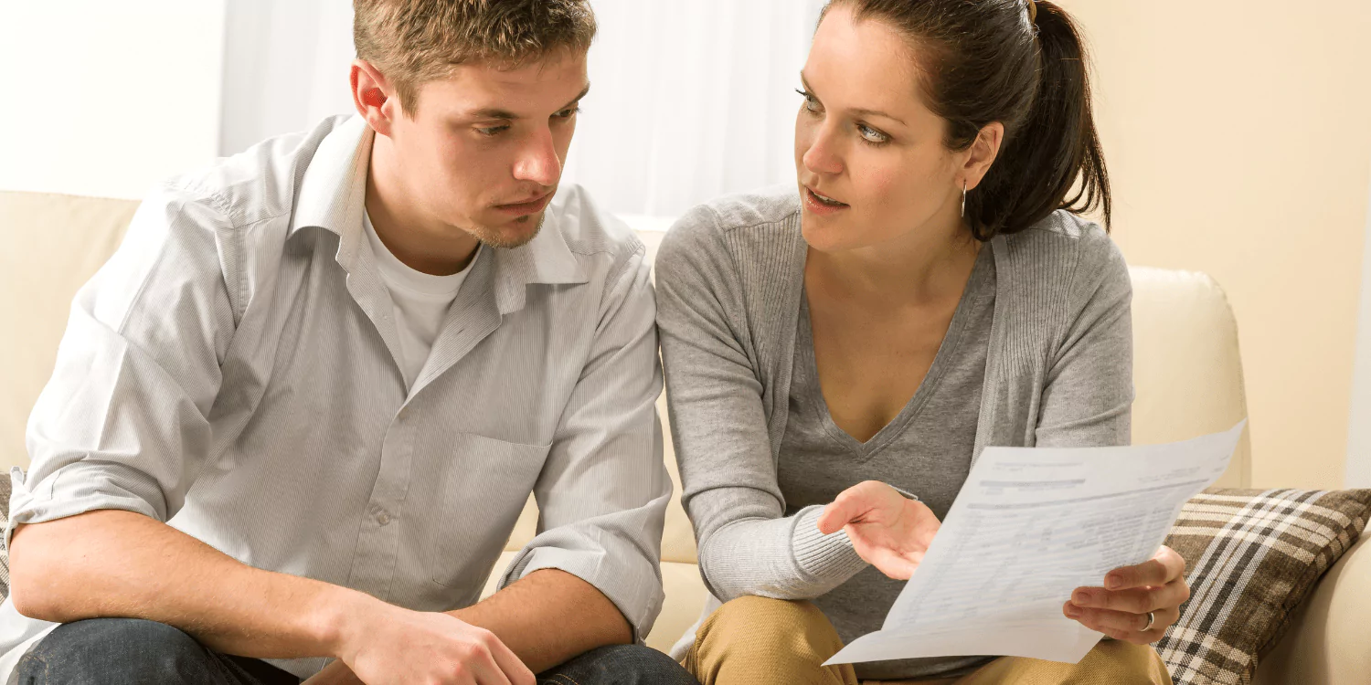 A couple that is looking into their finances and bankruptcy chapters to see which chapter to select, whether chapter 7 or chapter 13.