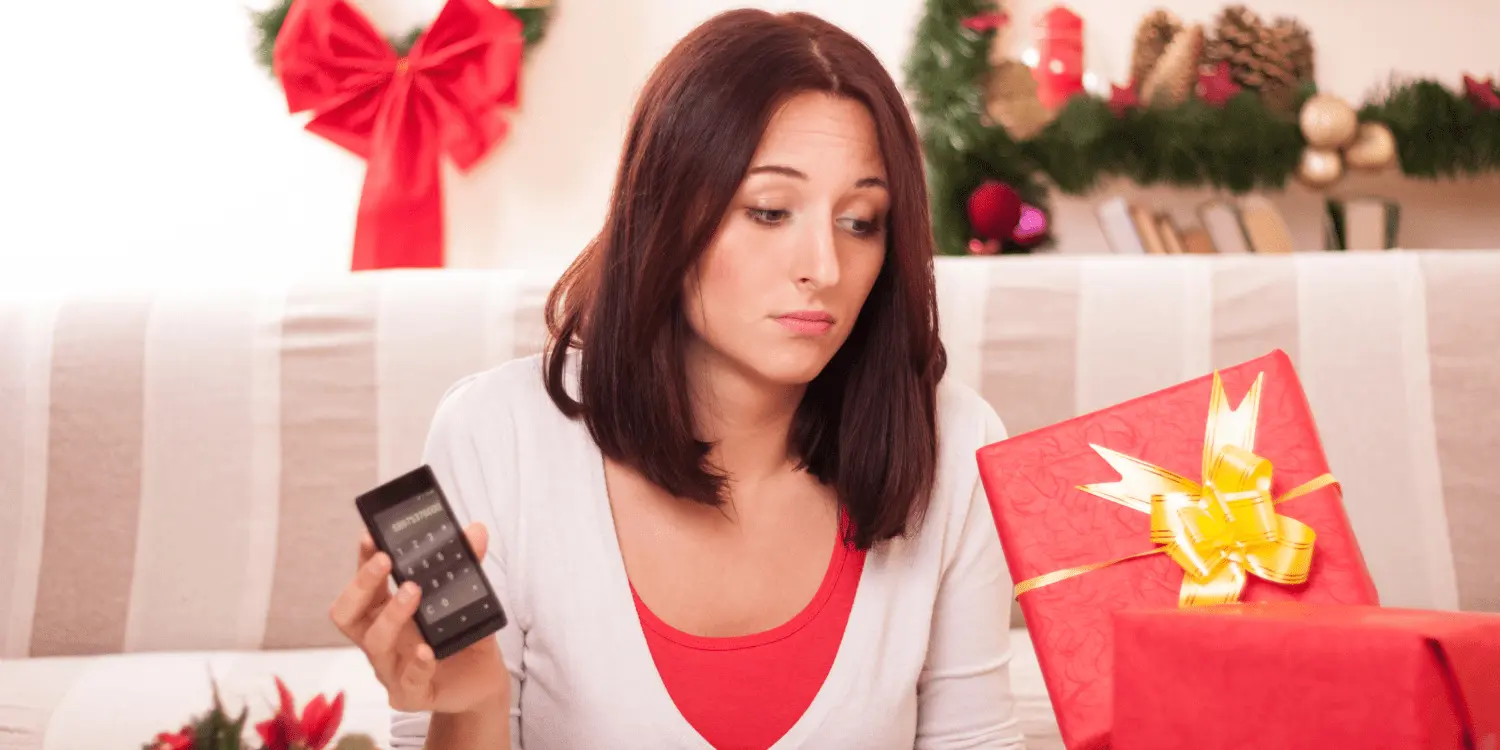 Women that is shopping online during the holidays at the comfort of her home.