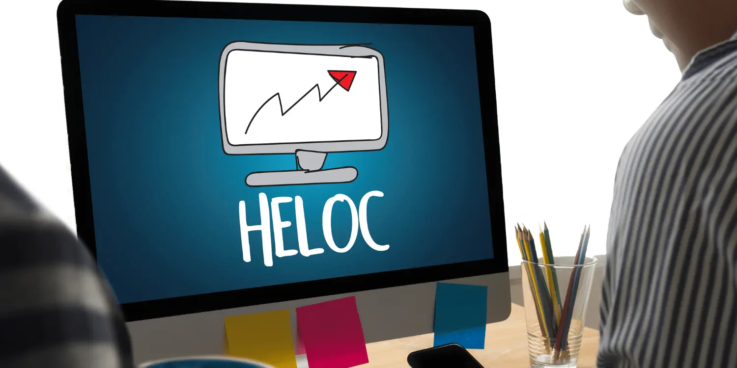 A person at a computer screen with "HELOC" on it researching if they are tax deductible.