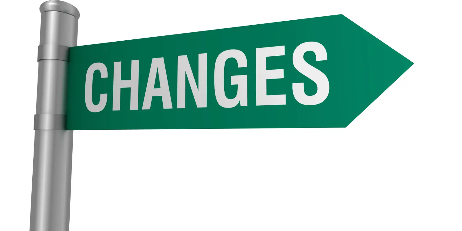 A green street sign displaying the word "Changes," symbolizing upcoming updates to credit reports and scores.