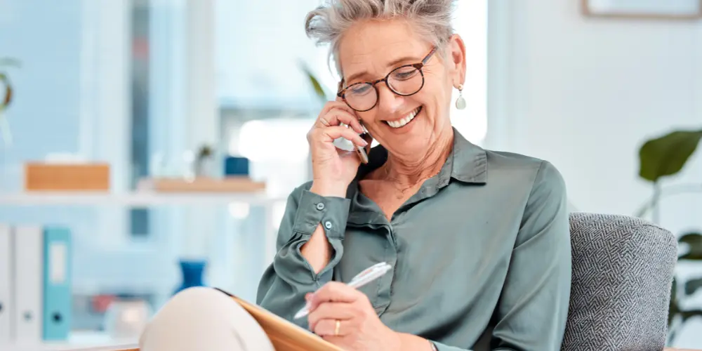 Male and female seniors looking over reverse mortgage documentation understand their reverse mortgage options.