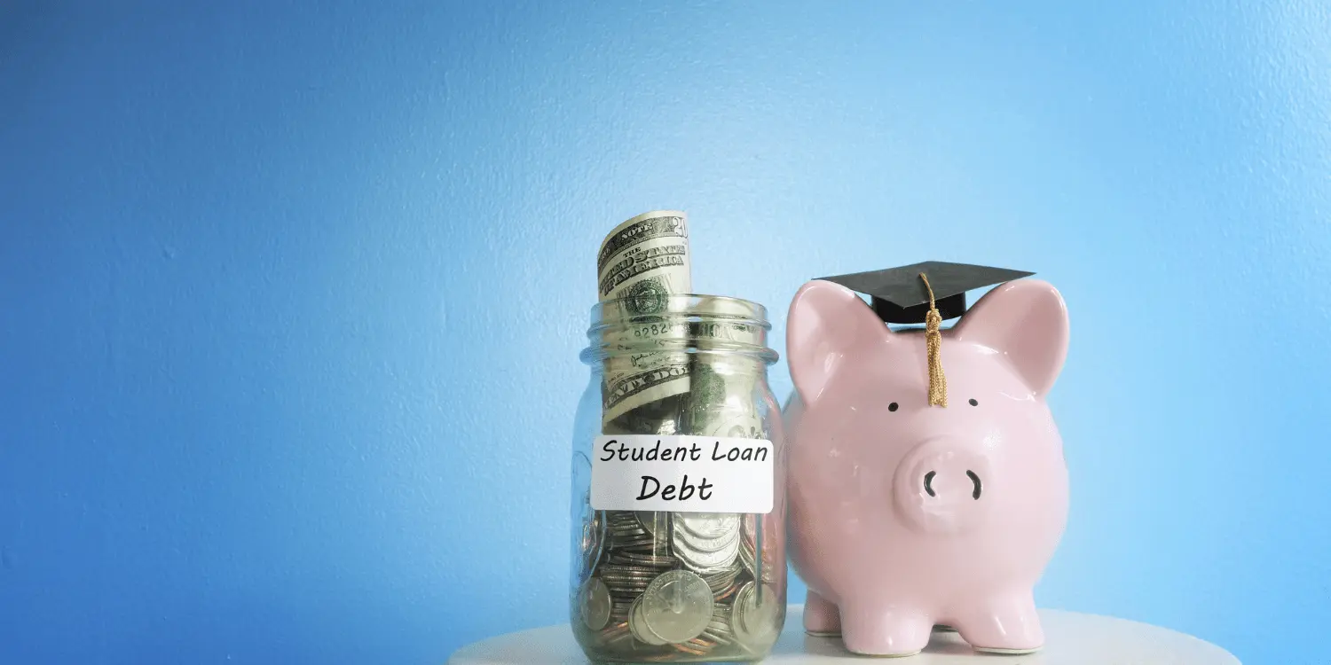 A piggy bank and graduation cap with money, symbolizing saving for education and reducing student loan debt.