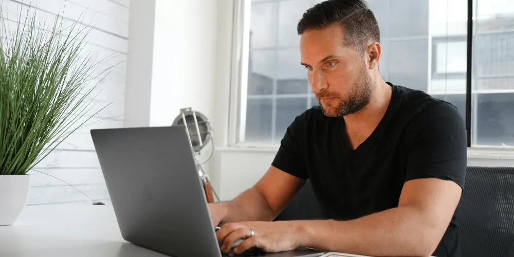 Renter researching fast ways to handle rent struggles and find emergency help online.