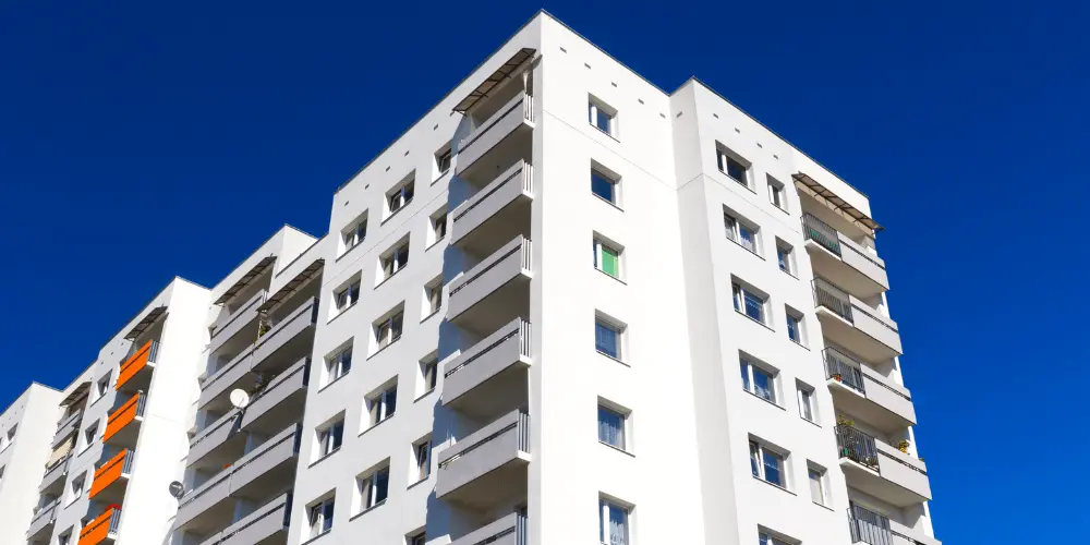 Apartment building symbolizing how debt management plans help renters stay housed while reducing debt.
