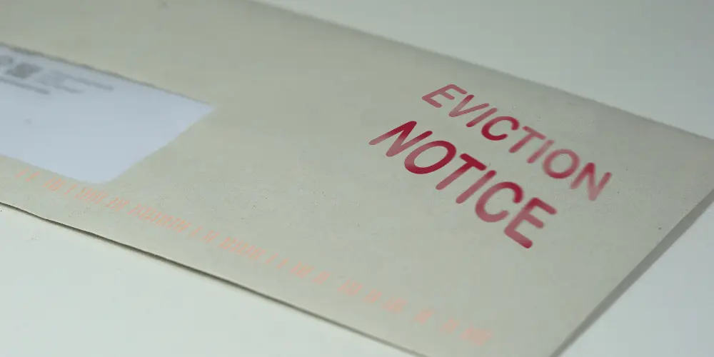Eviction notice letter symbolizing the need to act quickly and seek housing assistance.