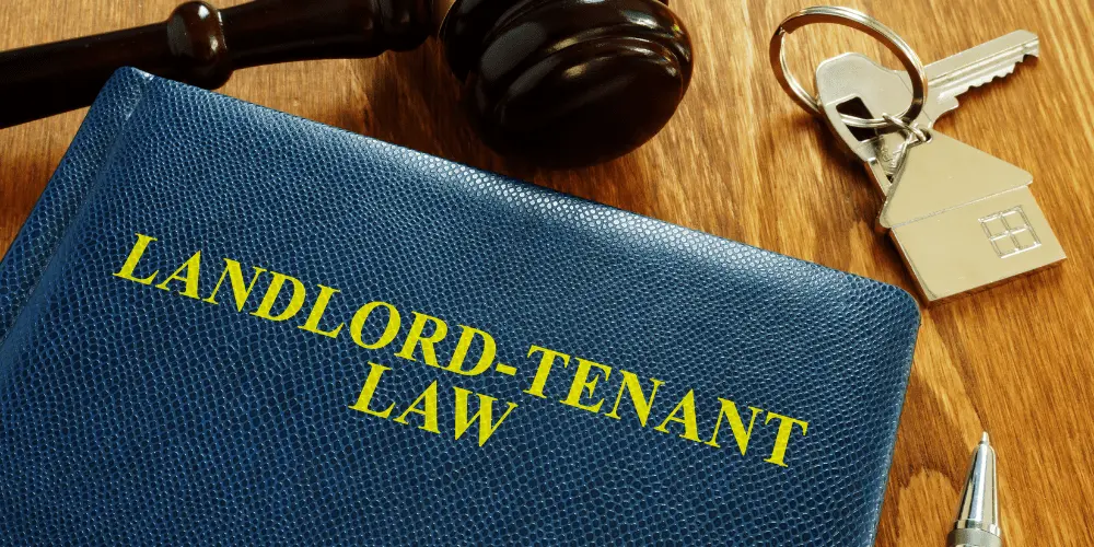 Landlord-tenant law book with keys and gavel, symbolizing tenant rights and housing protections during a government shutdown.
