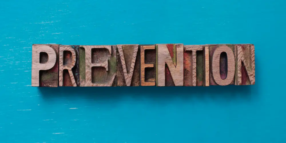 Colorful wooden letters spelling “prevention” highlight proactive steps to stop reverse mortgage defaults before they happen.