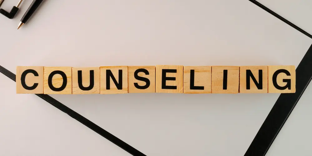 Wooden blocks spelling “COUNSELING” to illustrate financial guidance for disaster recovery.