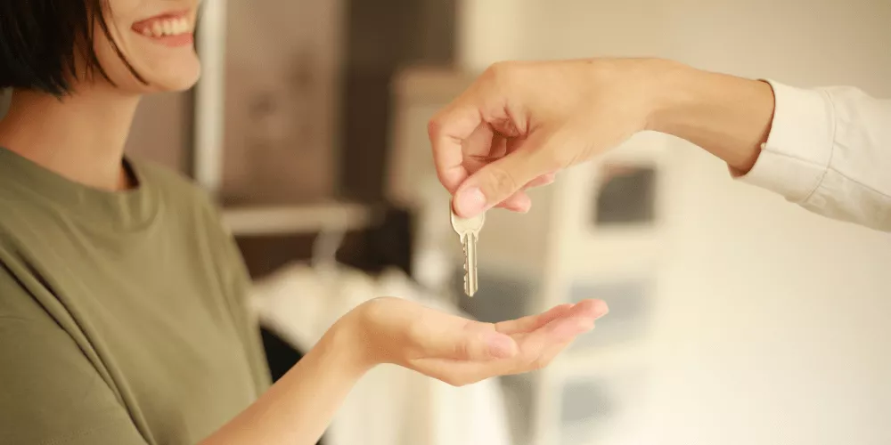 A person receiving house keys, symbolizing how Fannie Mae’s new rules make homeownership more achievable.