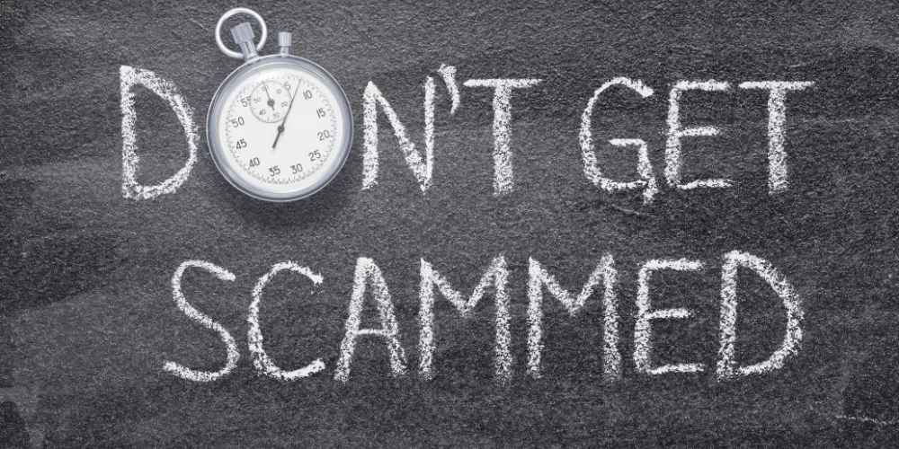 Text reading ‘Don’t Get Scammed’ with a stopwatch, urging student loan borrowers to act quickly and avoid fraud.