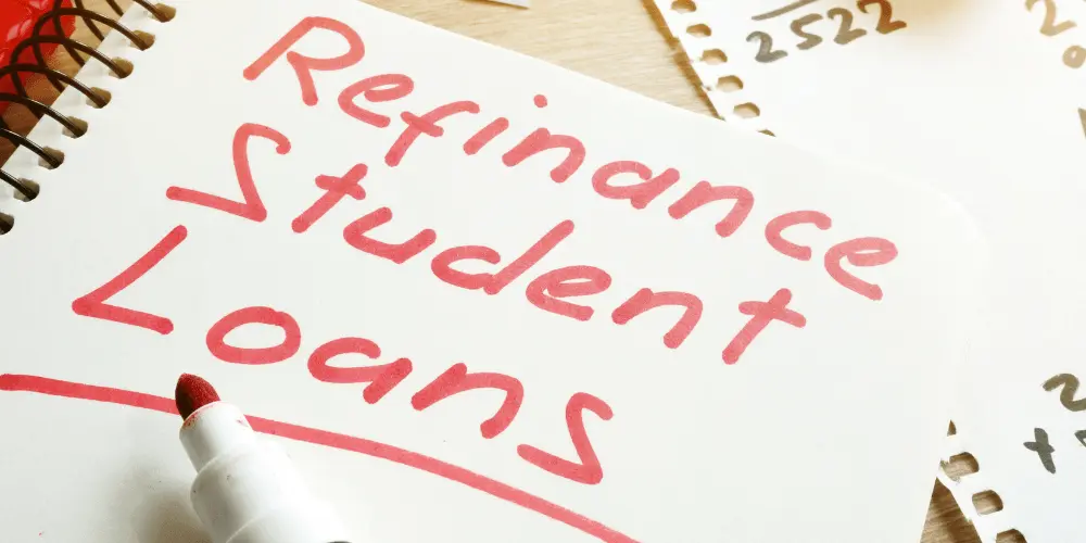 Notebook page with ‘Refinance Student Loans’ written in red marker, symbolizing planning before applying to refinance student debt.