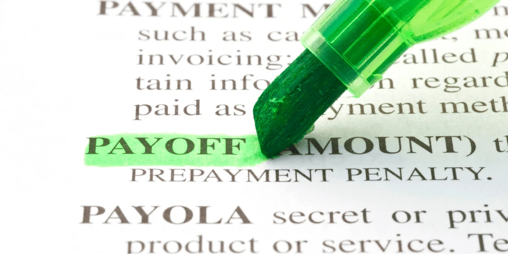 Highlighted payoff amount on a document, showing how a debt payoff calculator helps plan faster credit card debt repayment.
