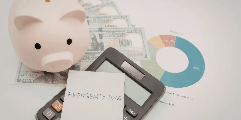 Emergency savings concept with calculator and budget screen, showing how to plan and track your financial safety net