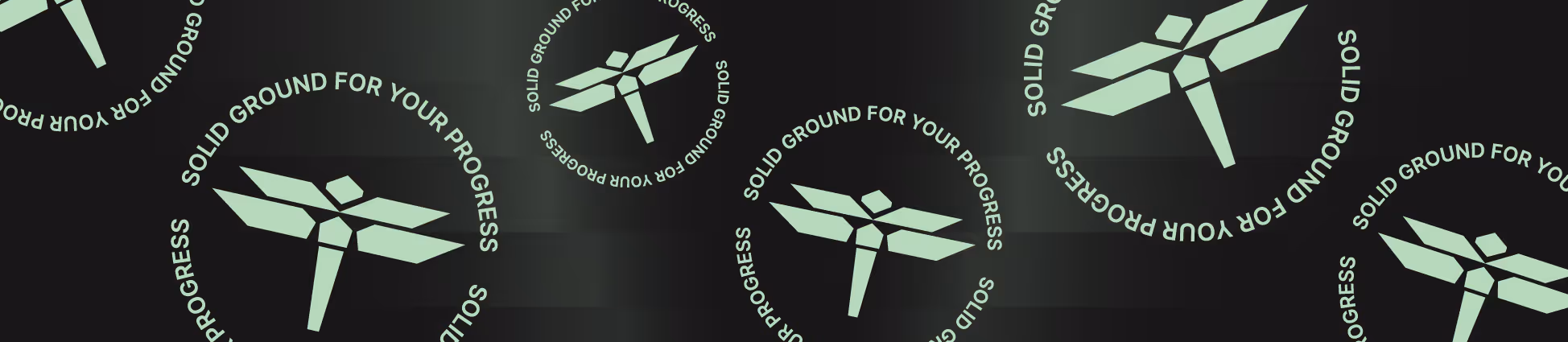 Abstract geometric symbol with text around it reading solid ground for your progress.