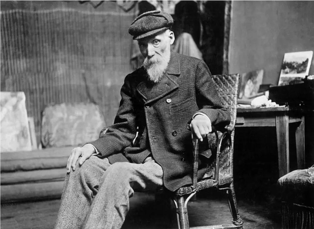 Renoir sitting in a chair, black and white