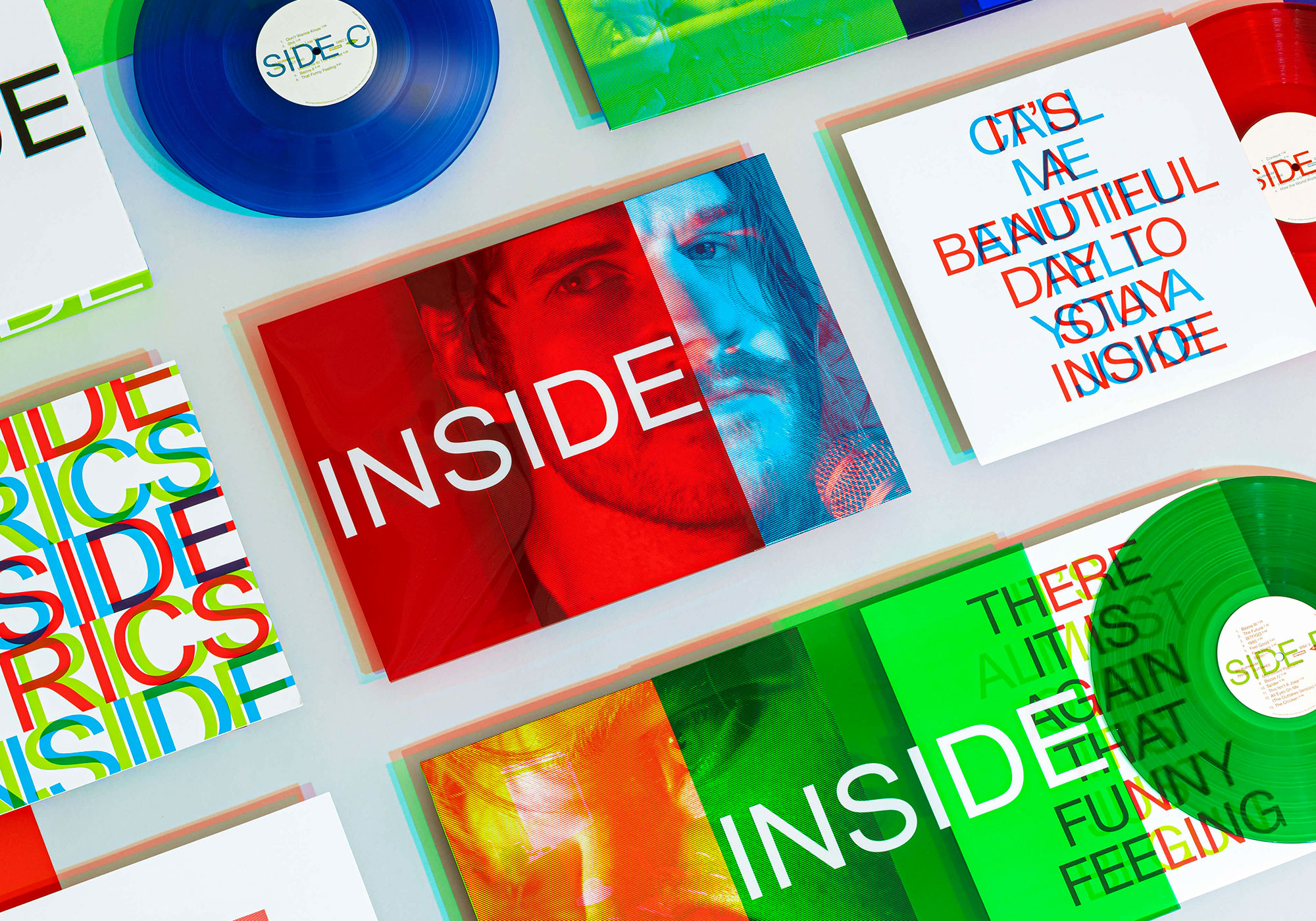 A laydown view of the record sleeves inside Bo Burnham's limited edition INSDIE boxset that Quietly designed.