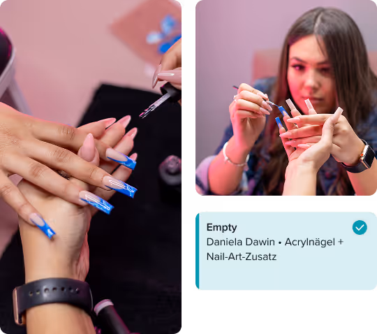 Close-up of a nail technician applying blue acrylic designs on long nails for a client.