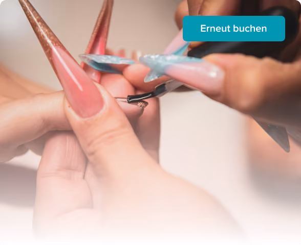 Close-up of a person applying light pink nail polish with glitter on fingernails during a manicure.