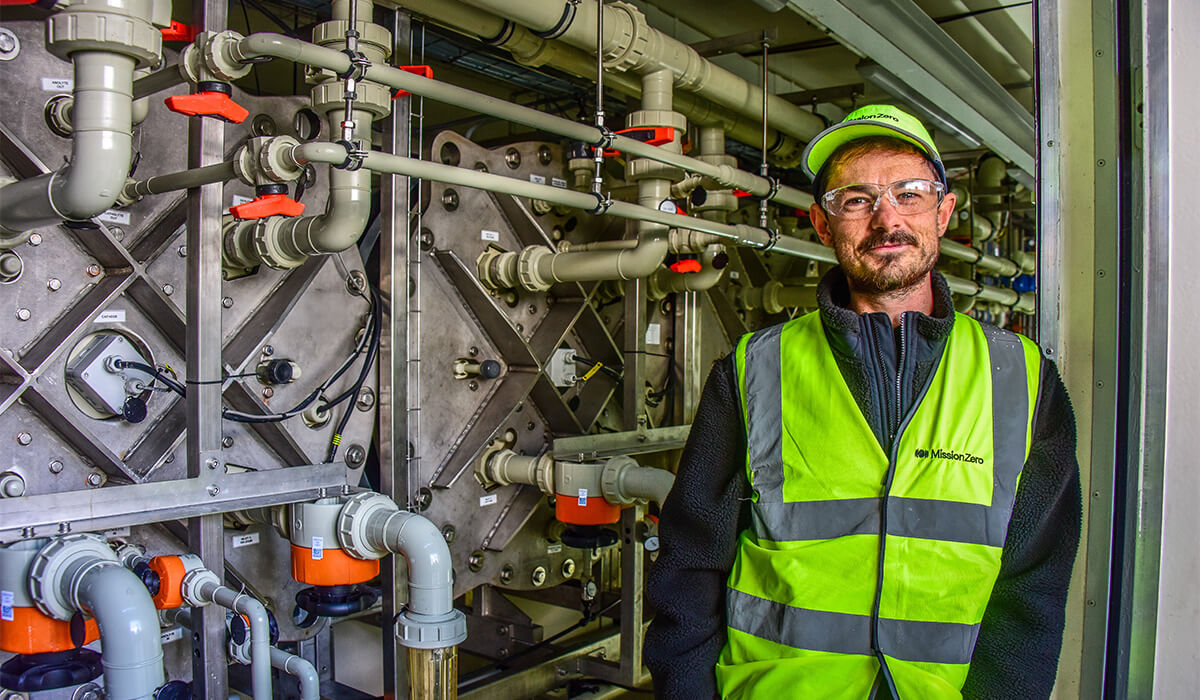 Dr Gaël Gobaille-Shaw standing inside a direct air capture unit.