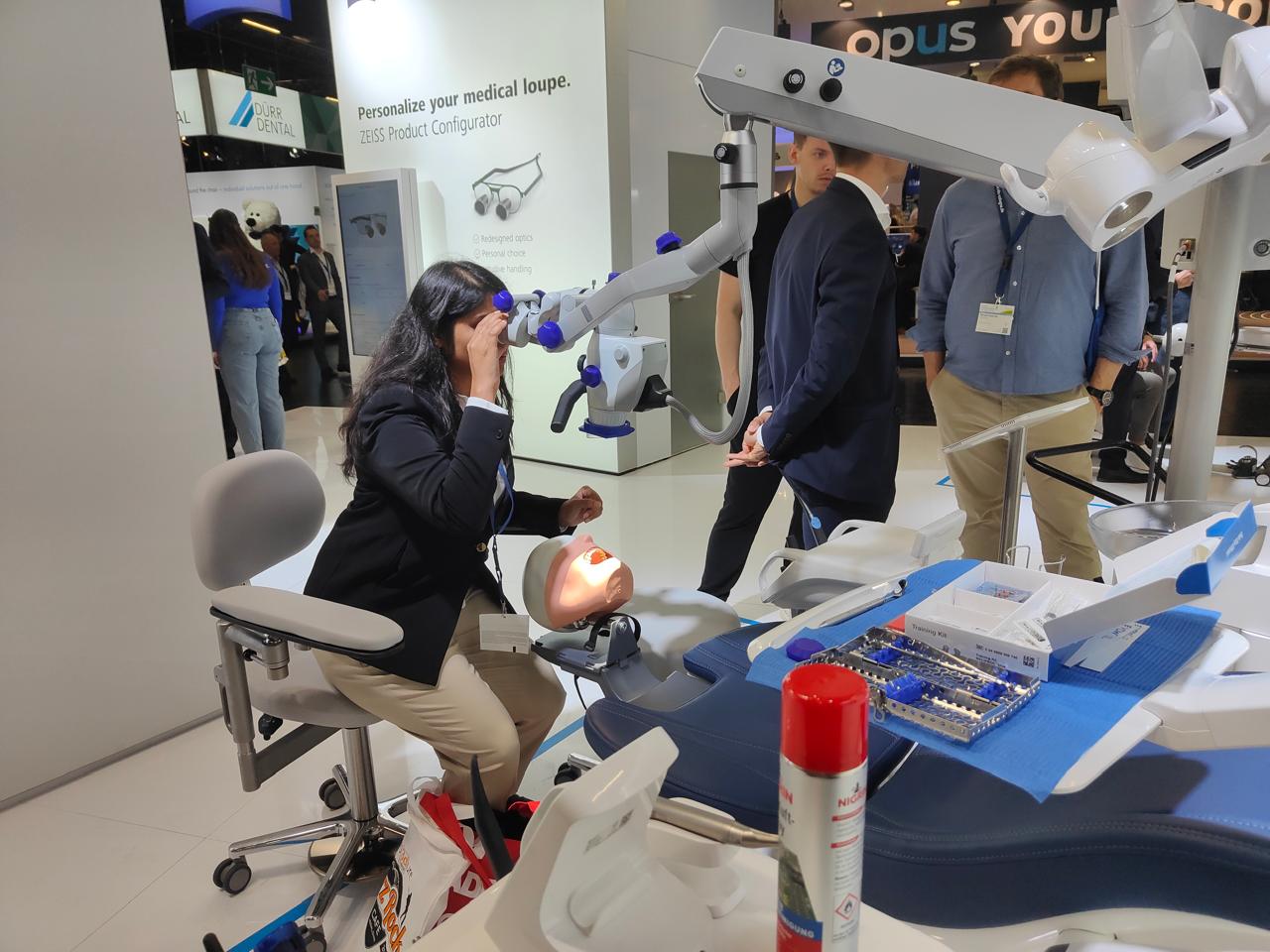 Dr. Varsha exploring dental technology at the International Dental Show in Cologne, Germany