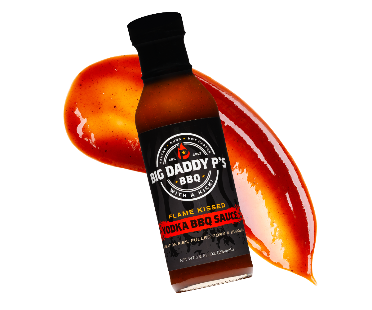 Bottle of Big Daddy P's Flame Kissed Vodka BBQ Sauce with sauce streak behind it.