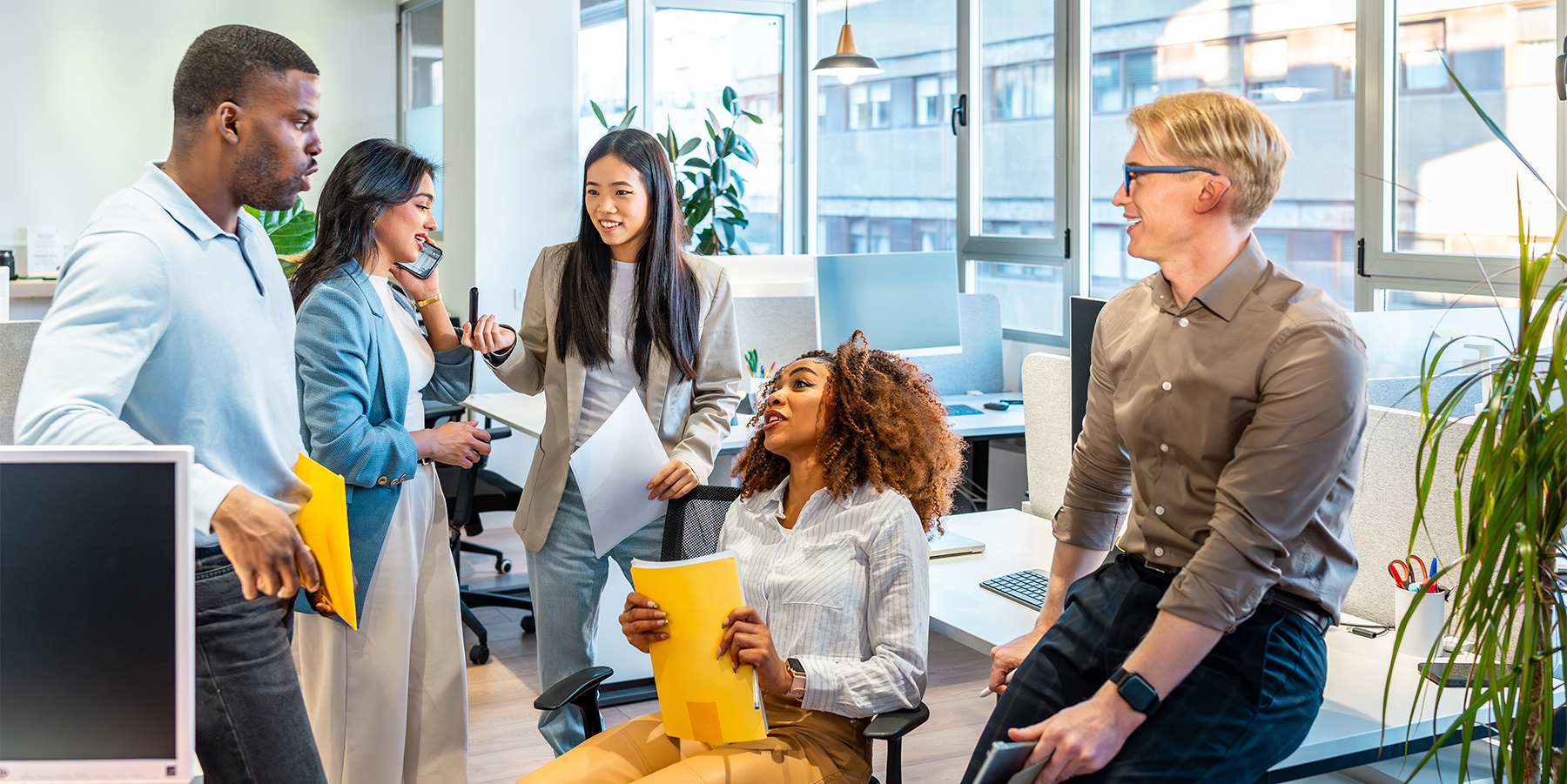 Diverse workforce collaborating in a healthy, supportive workplace environment