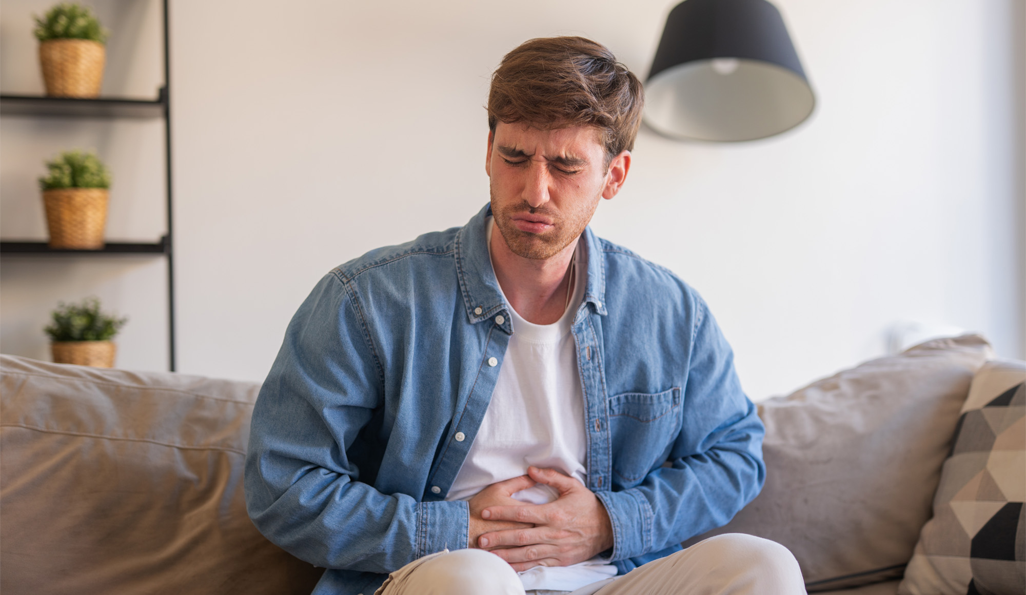 Person experiencing early physical signs of stress before recognizing it emotionally