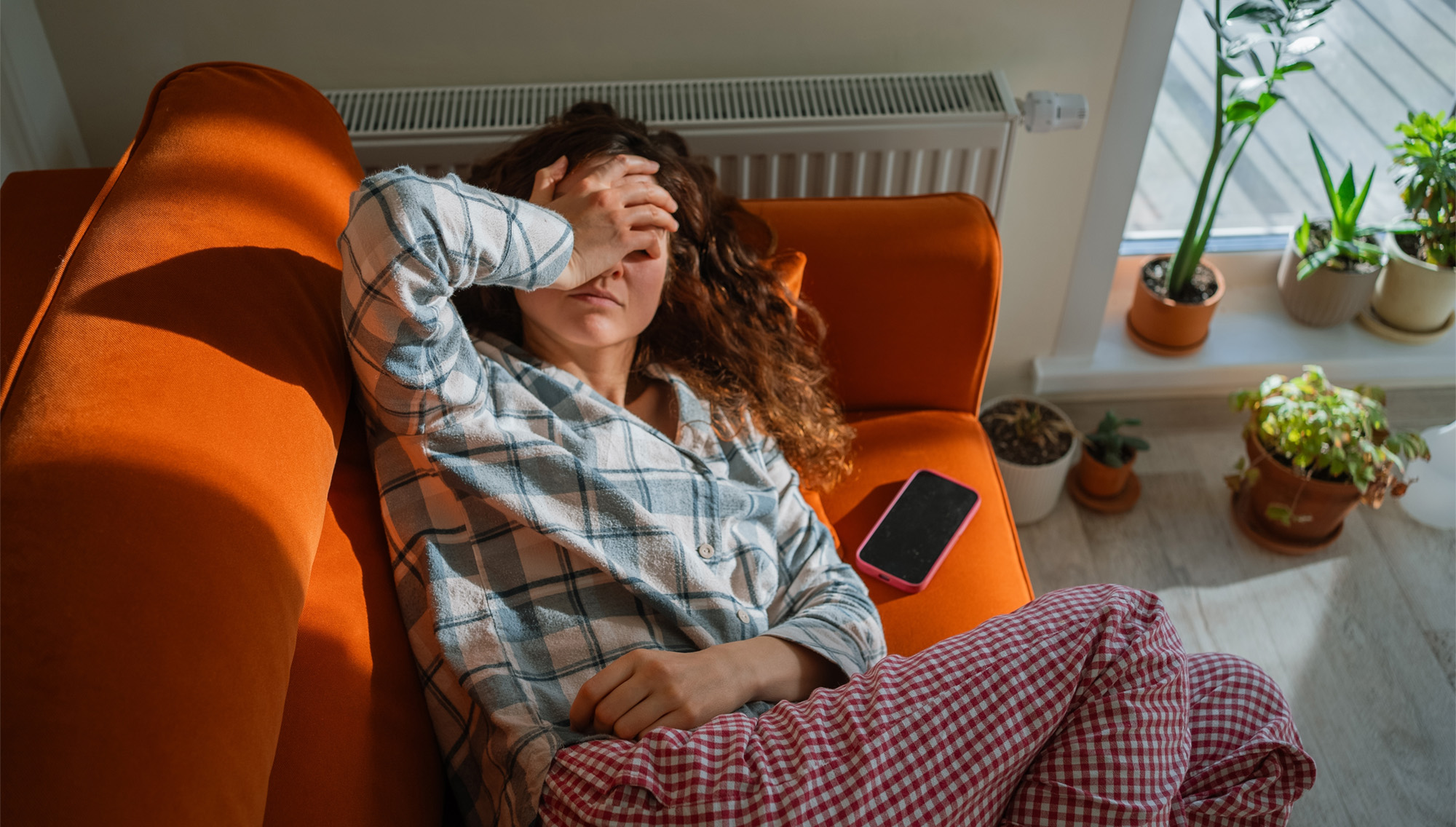 Person noticing physical stress symptoms like muscle tension and fatigue