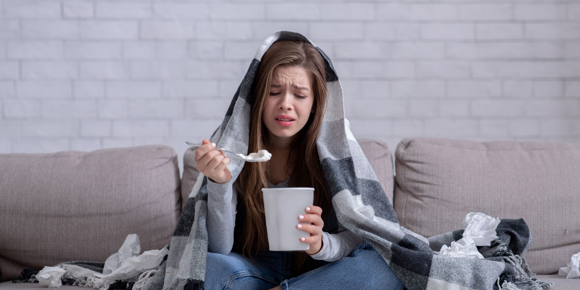 Person reaching for comfort food during a moment of stress or emotional discomfort