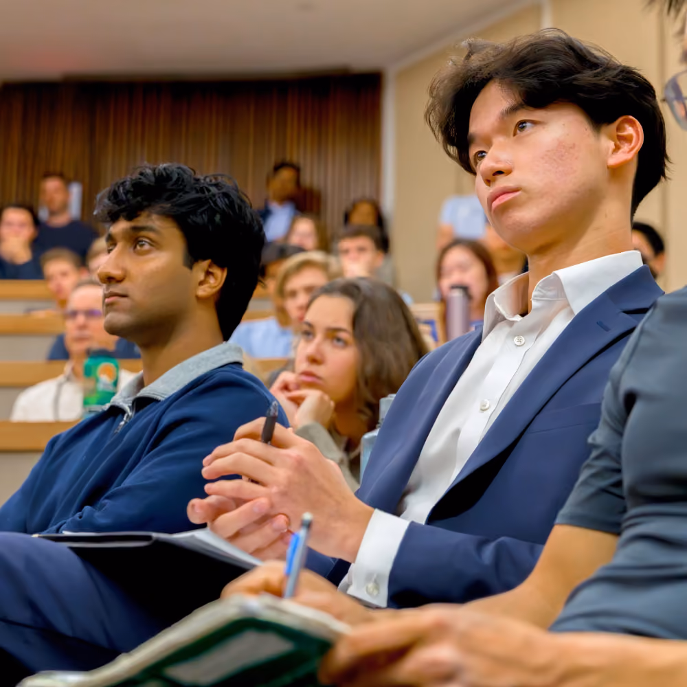 Students listening in a university lecture hall