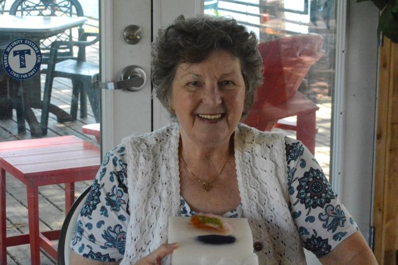 A person holding a piece of cakeAI-generated content may be incorrect.