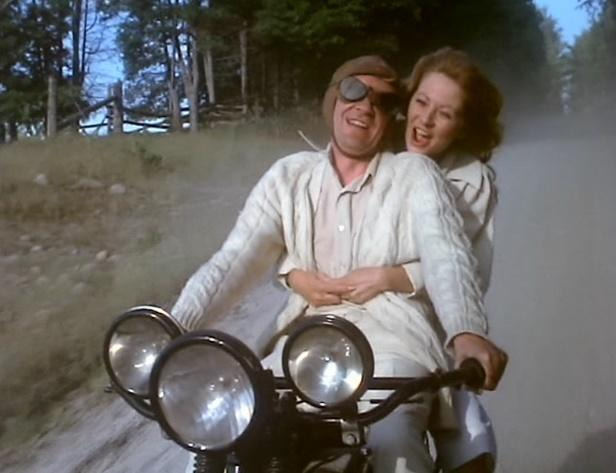 A person and person riding a motorcycleDescription automatically generated