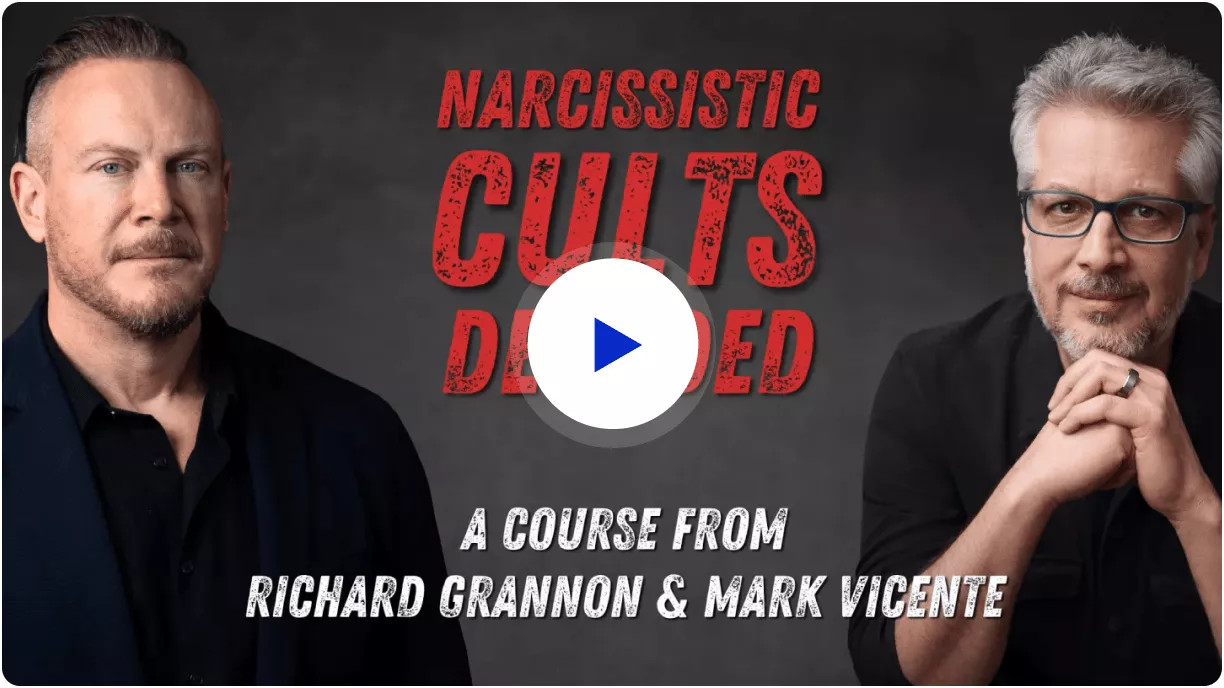 Two men in black shirts and one is wearing glasses.